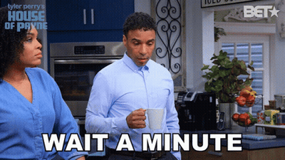 Man Holding Coffee And Woman Saying Wait A Minute GIF