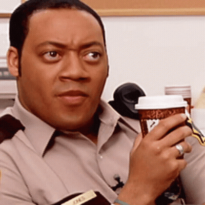 Man Holding Coffee Cup With JHEL Name Tag GIF