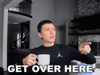 Man Holding Coffee Pointing Saying Get Over Here GIF