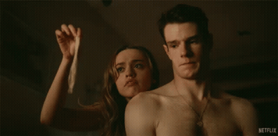 Man Holding Condom Next To Woman Saying Where's The Spunk GIF