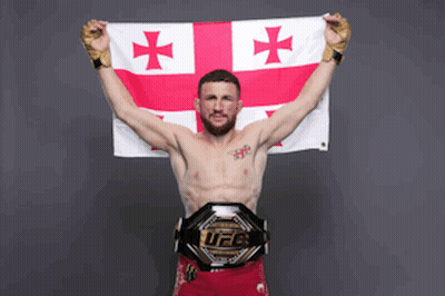 Man Holding Cross Flag And UFC Belt GIF