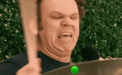 Man Holding Drum Stick Making Funny Face GIF