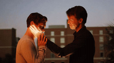 Man Holding Face With Bandage GIF