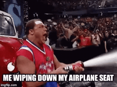 Man Holding Fire Extinguisher In Front Of Crowd GIF
