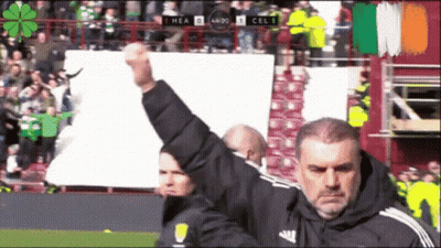 Man Holding Fist In Front Of Scoreboard GIF