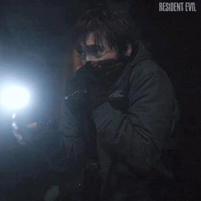 Man Holding Flashlight In Dark Wearing Mask GIF