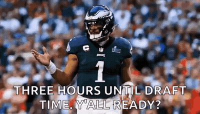 Man Holding Football In Front Of Primetime Sign GIF