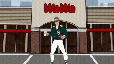 Man Holding Football In Front Of Wawa GIF
