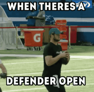 Man Holding Football With Caption When Theres A Defender Open GIF