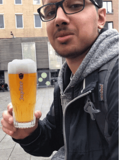 Man Holding Glass Of Jupiter Beer GIF