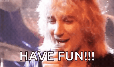 Man Holding Glass Saying Have Fun GIF