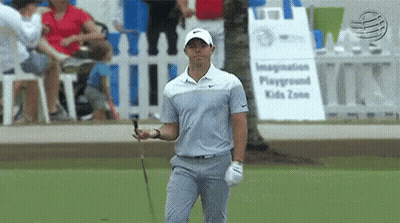 Man Holding Golf Club At Playground GIF