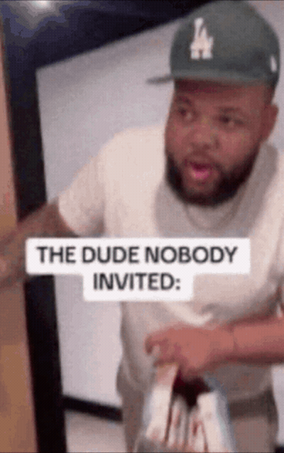 Man Holding Golf Club In Front Of Since 1927 Sign GIF