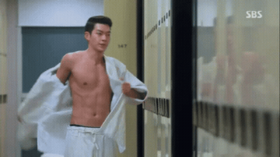 Man Holding Golf Club On Course With Korean Writing GIF