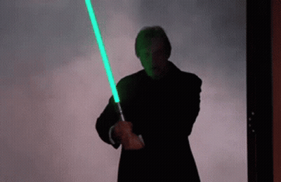 Man Holding Green Light Saber GIF