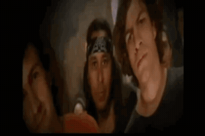 Man Holding Guitar Next To Man With Bandana GIF
