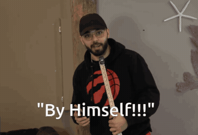 Man Holding Guitar Saying By Himself