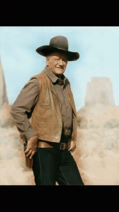 Man Holding Gun Cowboy Hat Leather Vest GIF