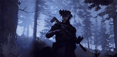 Man Holding Gun In Dark Forest At Night GIF