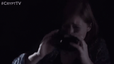 Man Holding Gun In Dark Room GIF