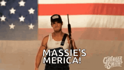 Man Holding Gun In Front Of American Flag GIF