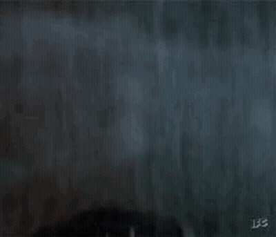 Man Holding Gun In Front Of Palm Tree GIF