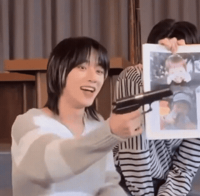 Man Holding Gun In Front Of Woman Picture GIF