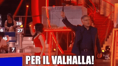 Man Holding Gun In Front Of Woman Saying Per Il Valhalla GIF