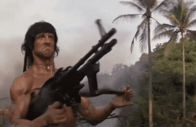 Man Holding Gun In Jungle GIF
