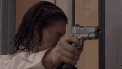Man Holding Gun In Room GIF