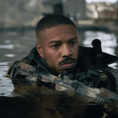 Man Holding Gun In Water GIF