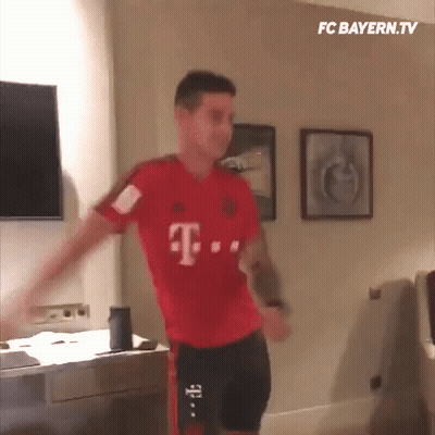 Man Holding Gun Next To Another In Desert GIF