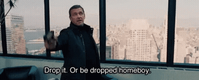 Man Holding Gun Says Drop It Or Be Dropped Homeboy GIF