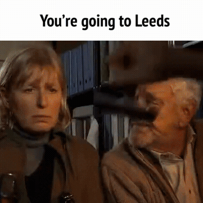 Man Holding Gun Sitting Next To Woman GIF