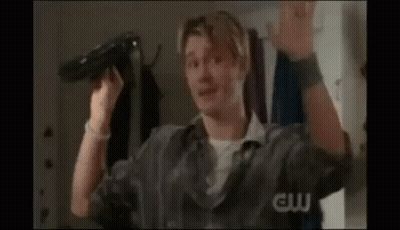 Man Holding Hair Dryer Making Funny Face GIF