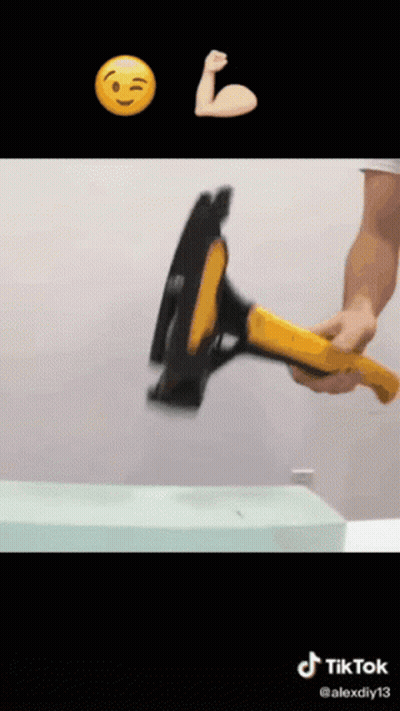 Man Holding Hammer In Front Of Smiley Face GIF