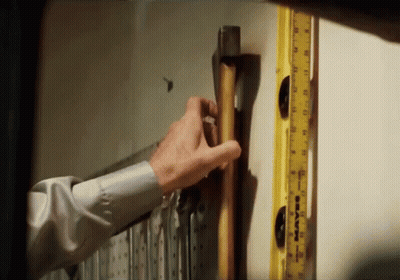 Man Holding Hammer Next To Yellow Ruler Saying Maven GIF