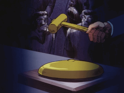 Man Holding Hammer Over Yellow Object GIF