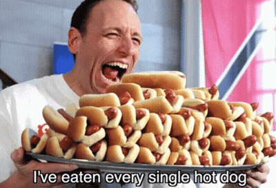 Man Holding Hot Dogs Saying I've Eaten Every Single Hot Dog GIF