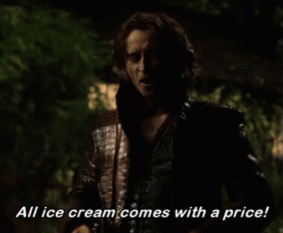 Man Holding Ice Cream Scoop And Ben & Jerry's Cup GIF