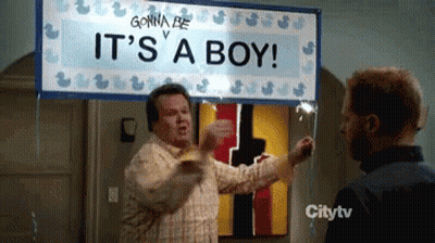 Man Holding It's A Boy Sign GIF