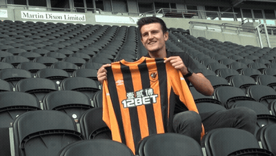 Man Holding Jersey Saying 12Bet GIF