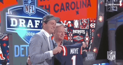 Man Holding Jersey Saying Maye 1 GIF