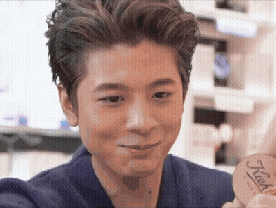 Man Holding Kiehl's Product In Front Of Face GIF