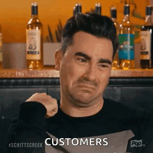 Man Holding Knife In Front Of Bar Says Customers GIF