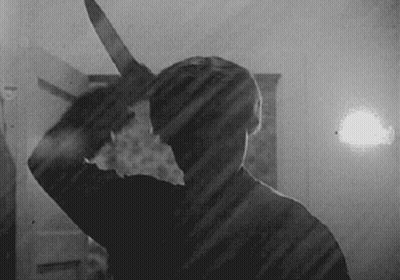 Man Holding Large Knife GIF