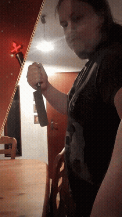 Man Holding Large Knife GIF
