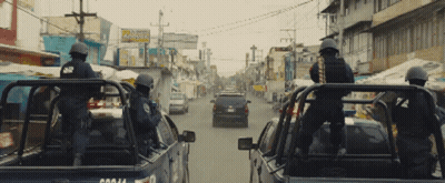 Man Holding Large Rifle In Blurry Picture GIF