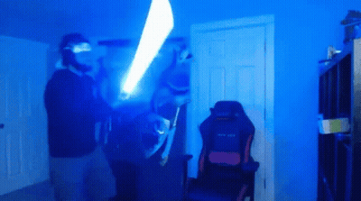 Man Holding Light Saber GIF