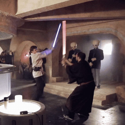 Man Holding Light Saber GIF